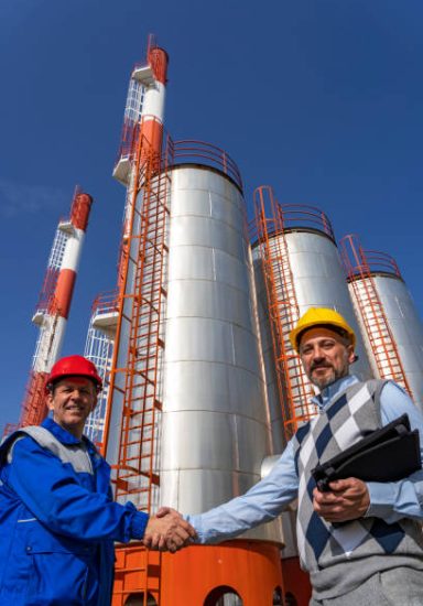 Worker in Personal Protective Equipment Meeting with Businessperson. Teamwork and Business Relationship Concept.